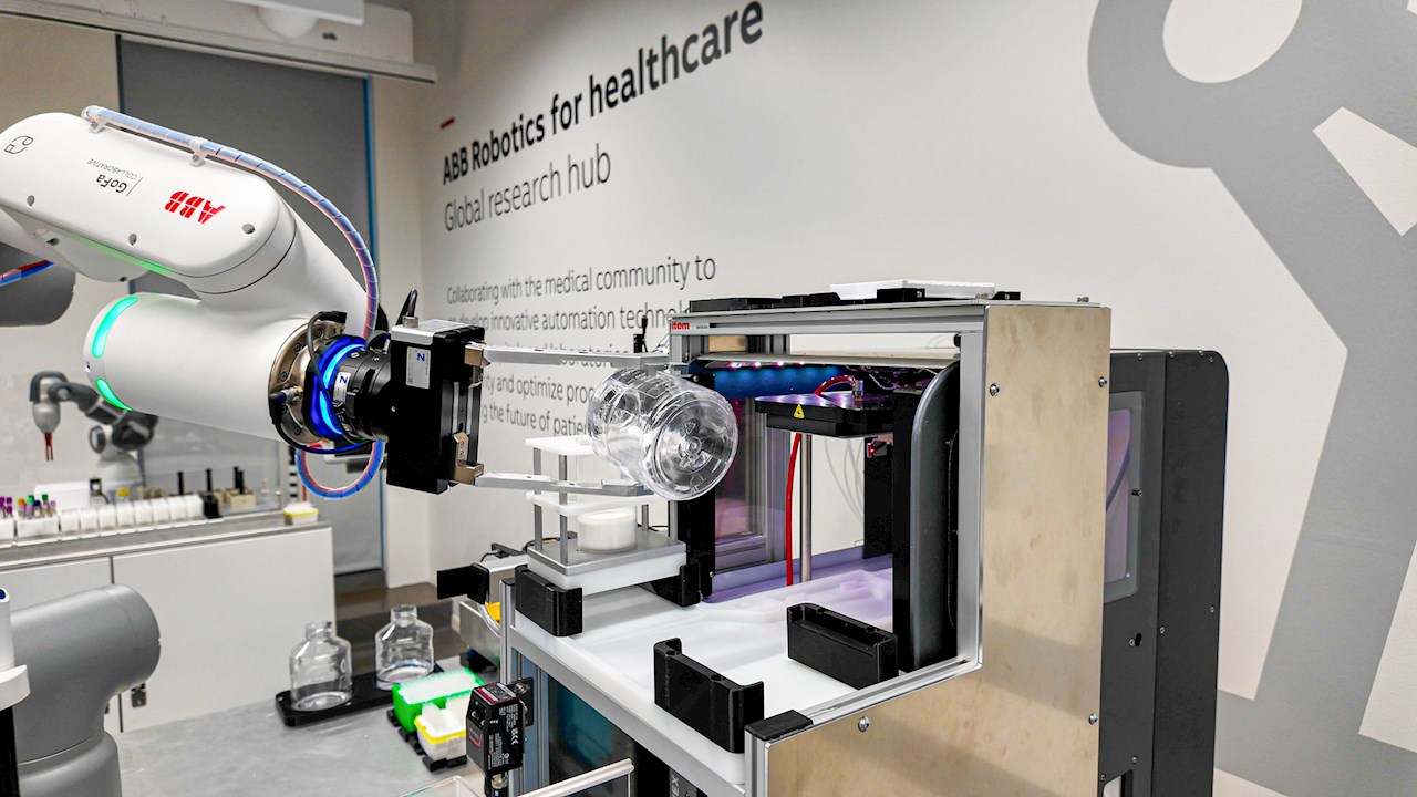 ABB cobot delicately handling a laboratory bottle, demonstrating its ability automation laboratory tasks