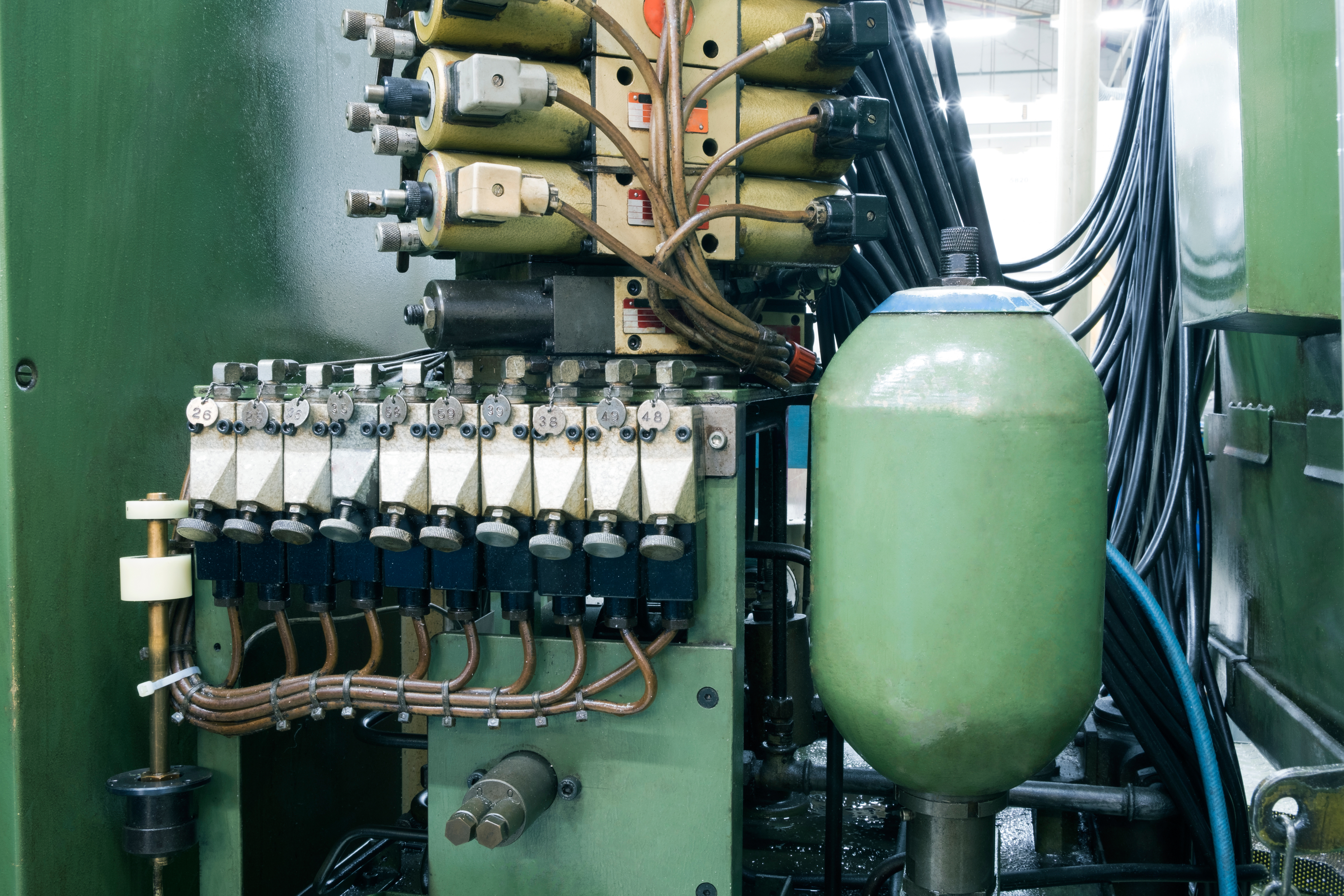 hydraulic accumulator located within fluid system
