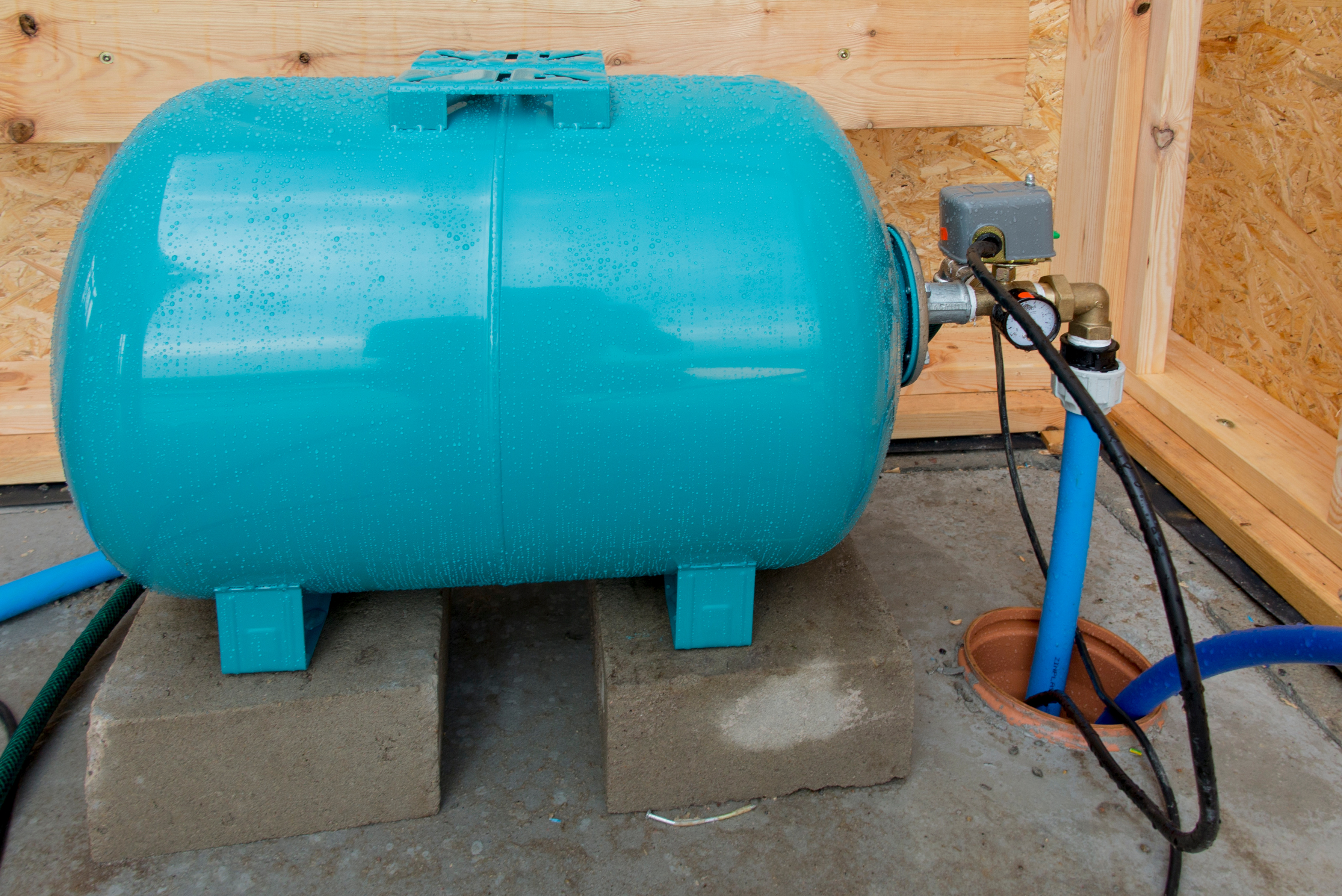 pressurized water storage tank with a charged gas chamber inside to maintain a consistent water pressure in a whole-house system