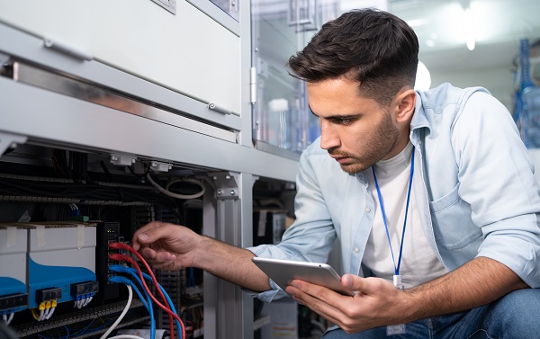 Technician working on networking equipment