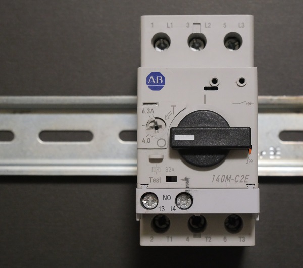 A three-phase circuit breaker with a rotary knob