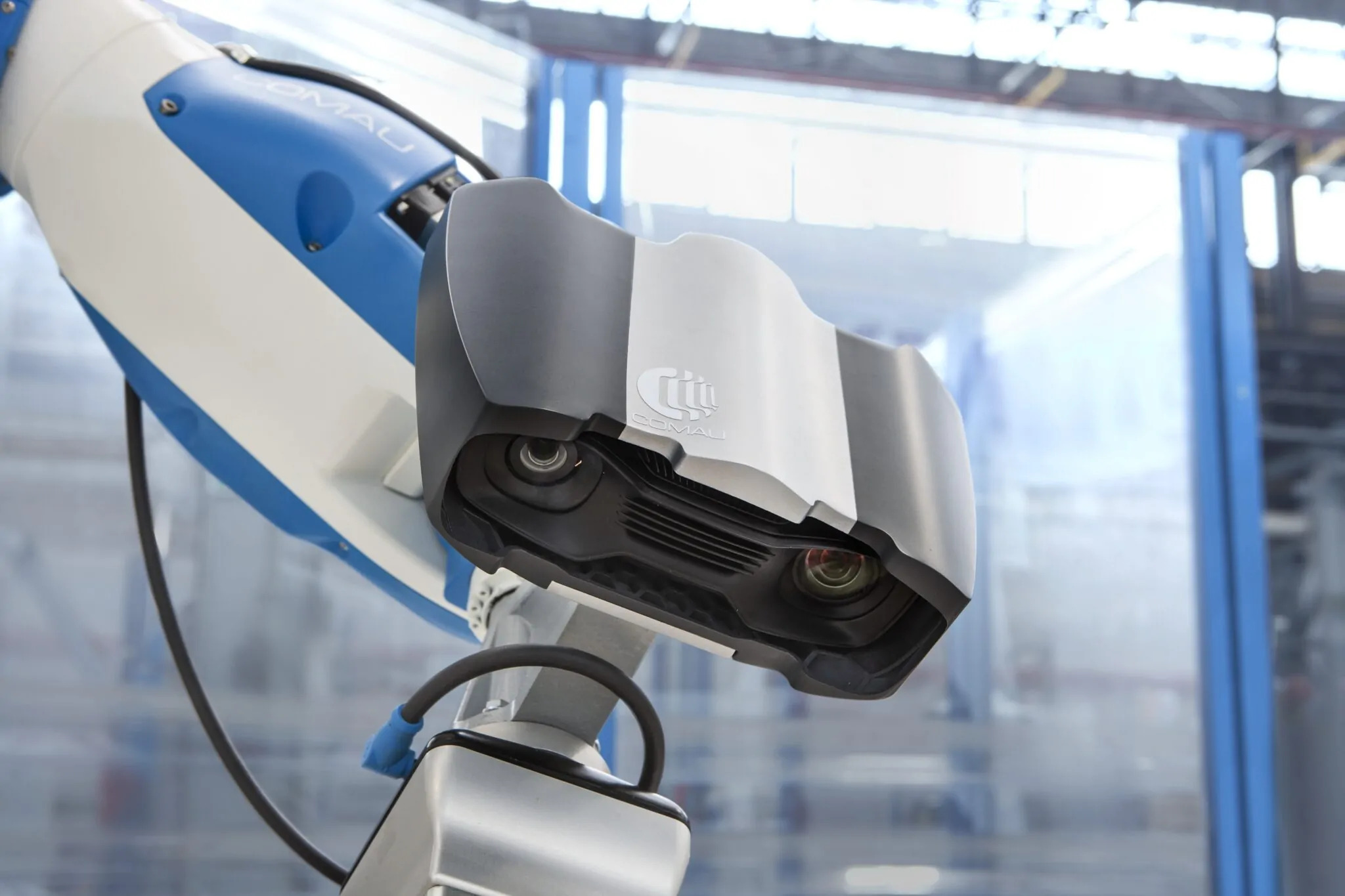 A Zivid structured light camera fixed to Comau’s Racer-5 COBOT