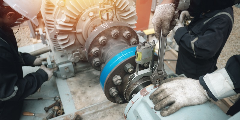 Engineers repairing a motor