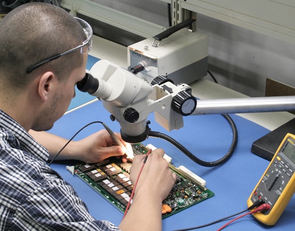 Technician repairing circuit board
