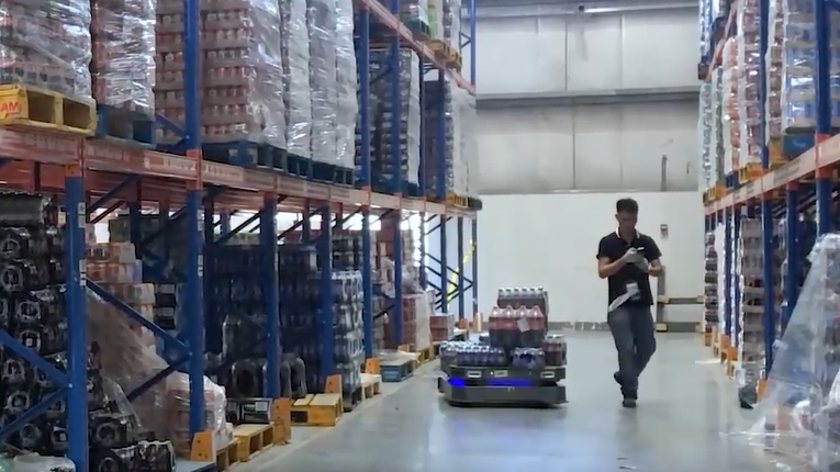 ForwardX Max Series autonomous mobile robots in beverage warehouse assisting workers