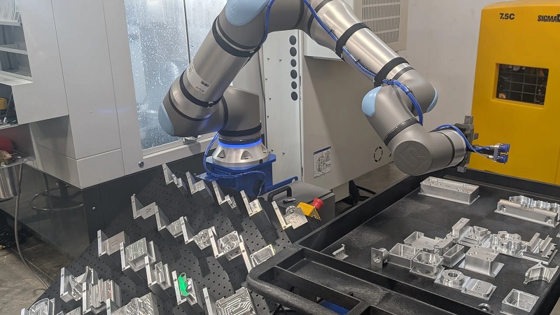A UR cobot loading a CNC machine