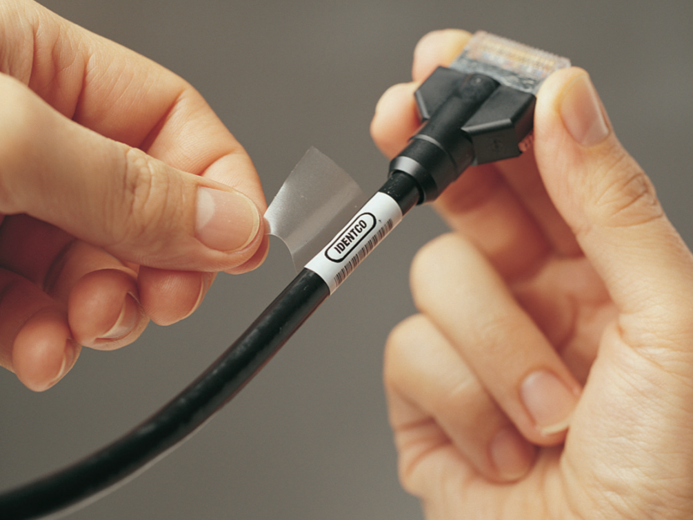 Identco’s DuraWrap and DuraFlag labels are self-laminating and print-on-demand