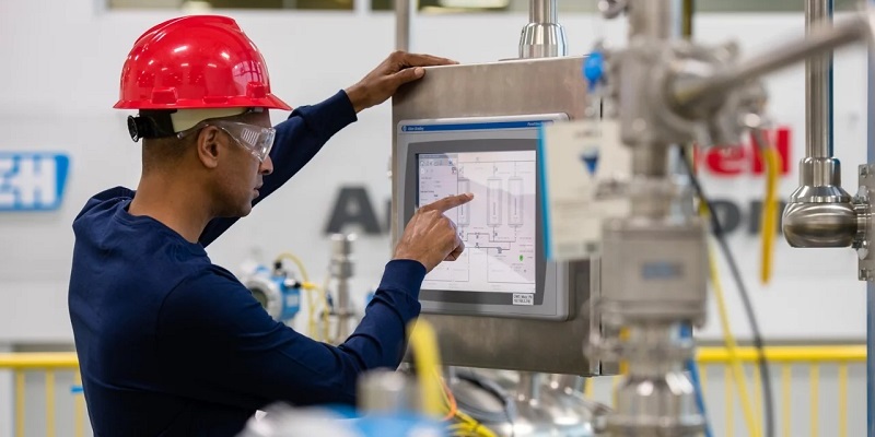 Technician using a human-machine interface (HMI)