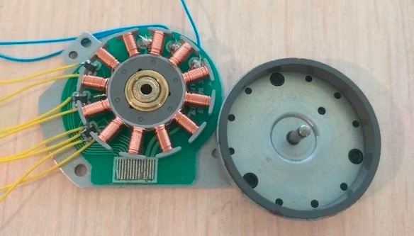 Hall sensors (with yellow wires) placed around the stator coils of a brushless DC motor