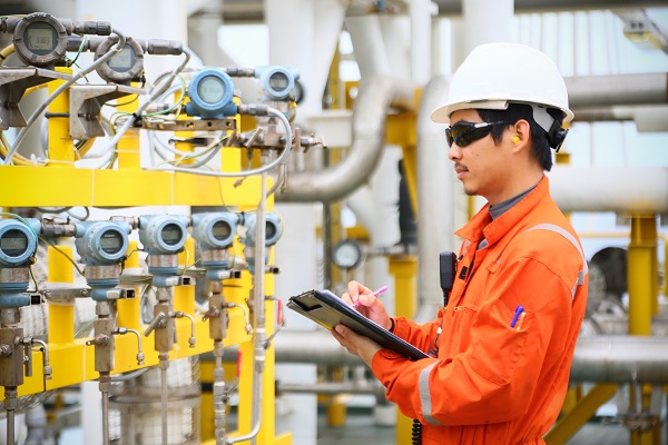 Experienced operator reviewing instruments