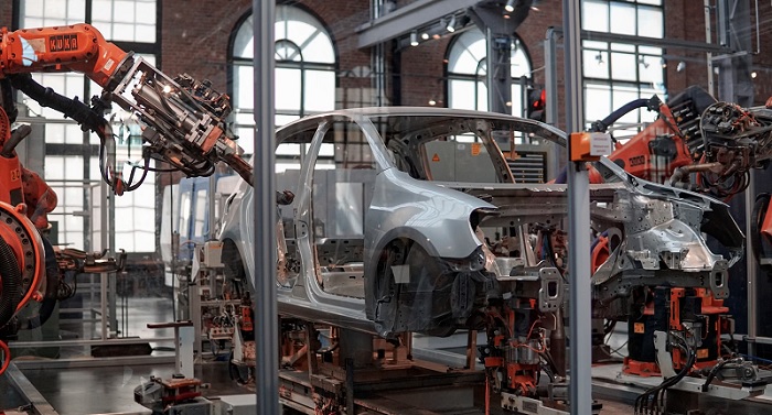 Gray car assembled by industrial robots