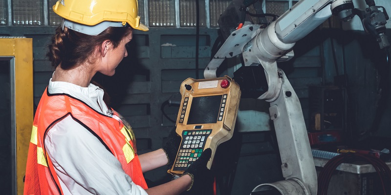 Technician jogging a robot