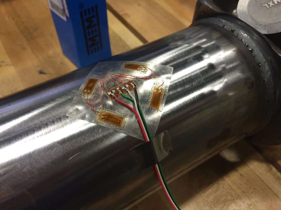 strain gauge bonded to surface of a shaft