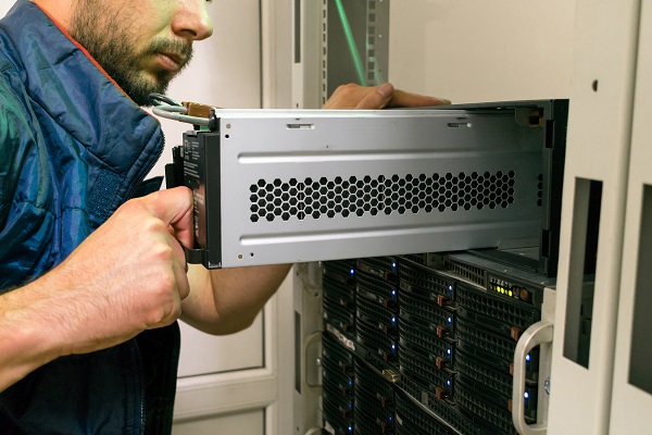Technician installing a UPS