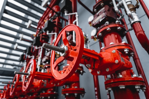 Multiple valves in a fire control system for an industrial facility
