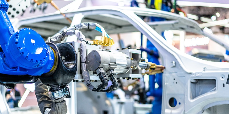 Robot welding a car part