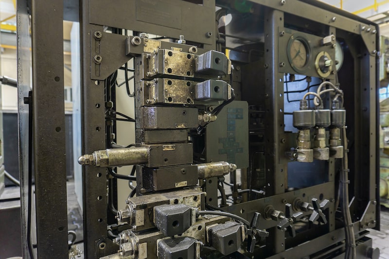 Hydraulic systems, like this one used for metal cutting, require an SIS in place to protect both personnel and product.