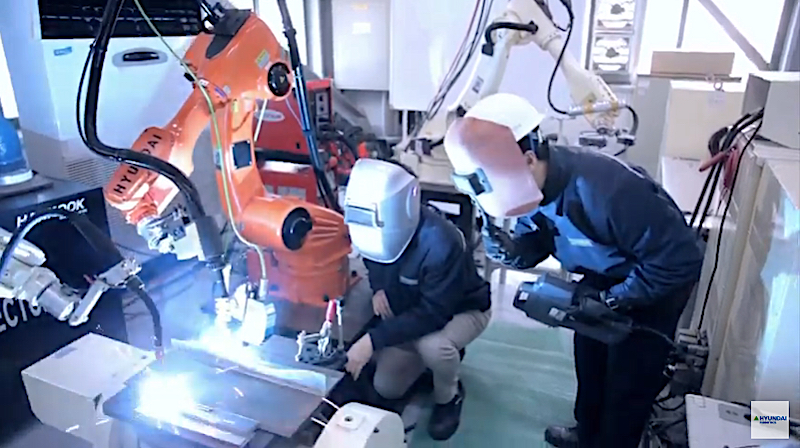 Hyundai Robotics welding robot and staff