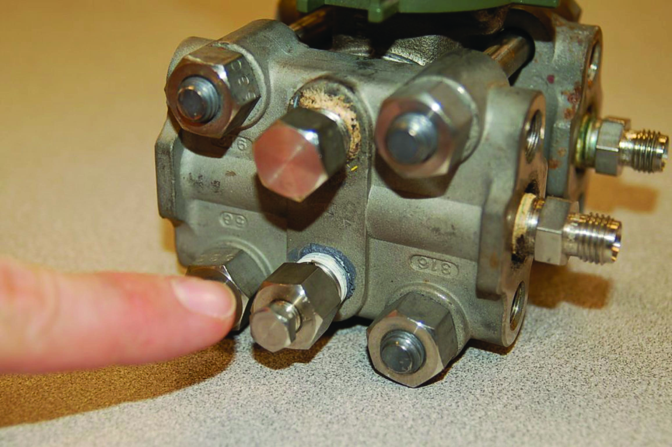 Close-up views of a down bleed fitting