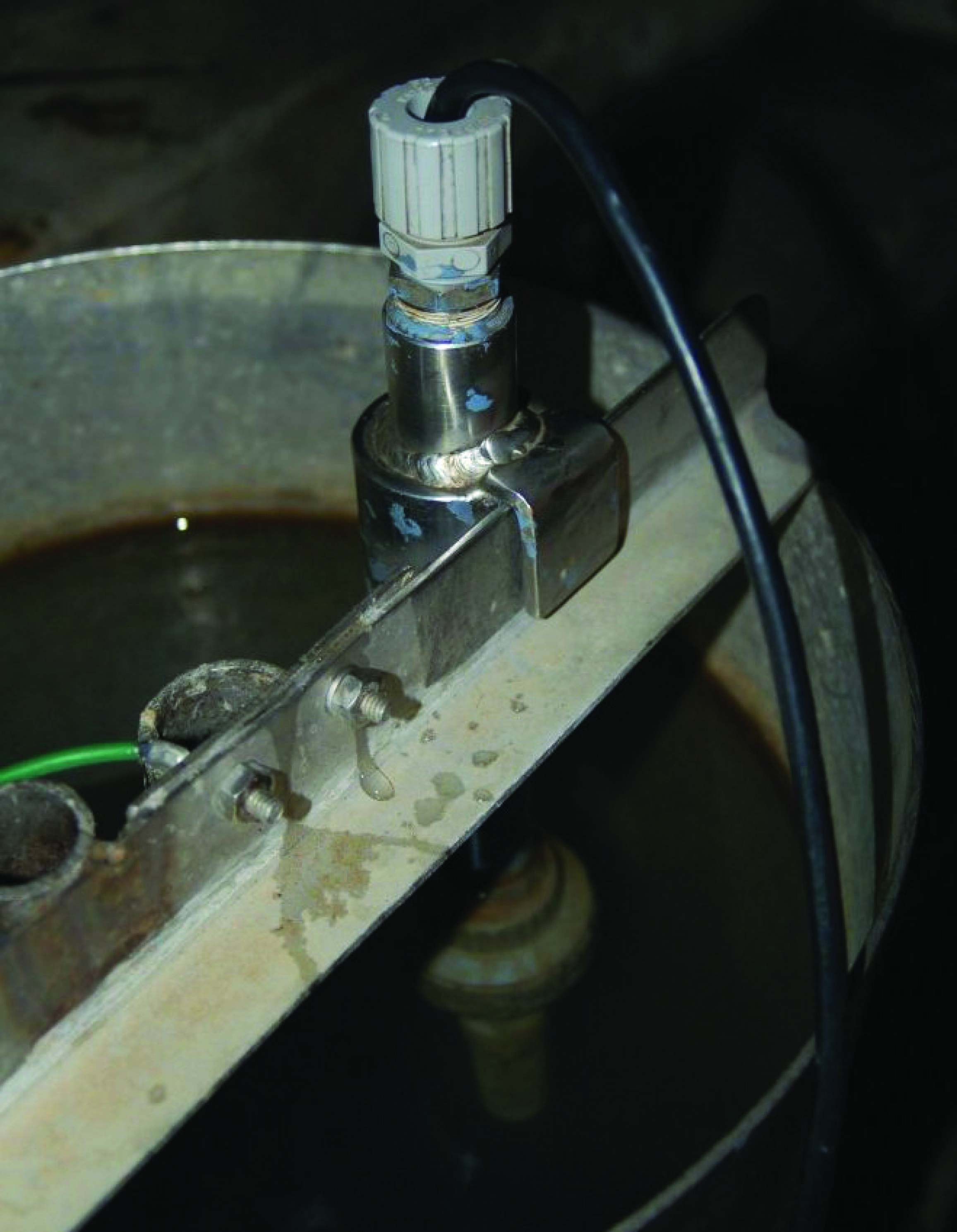 open-top stainless steel tank where the pH probe hangs
