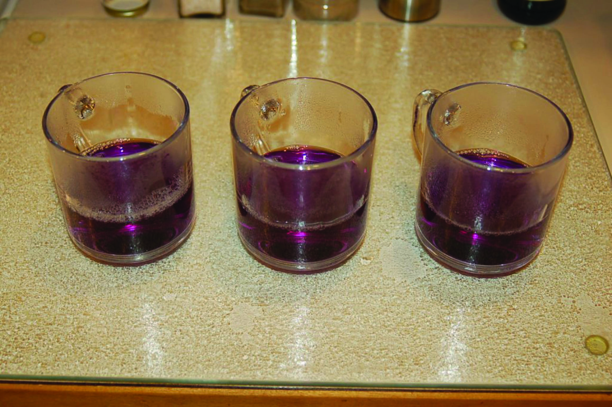 cabbage liquid transfered to three glasses for testing