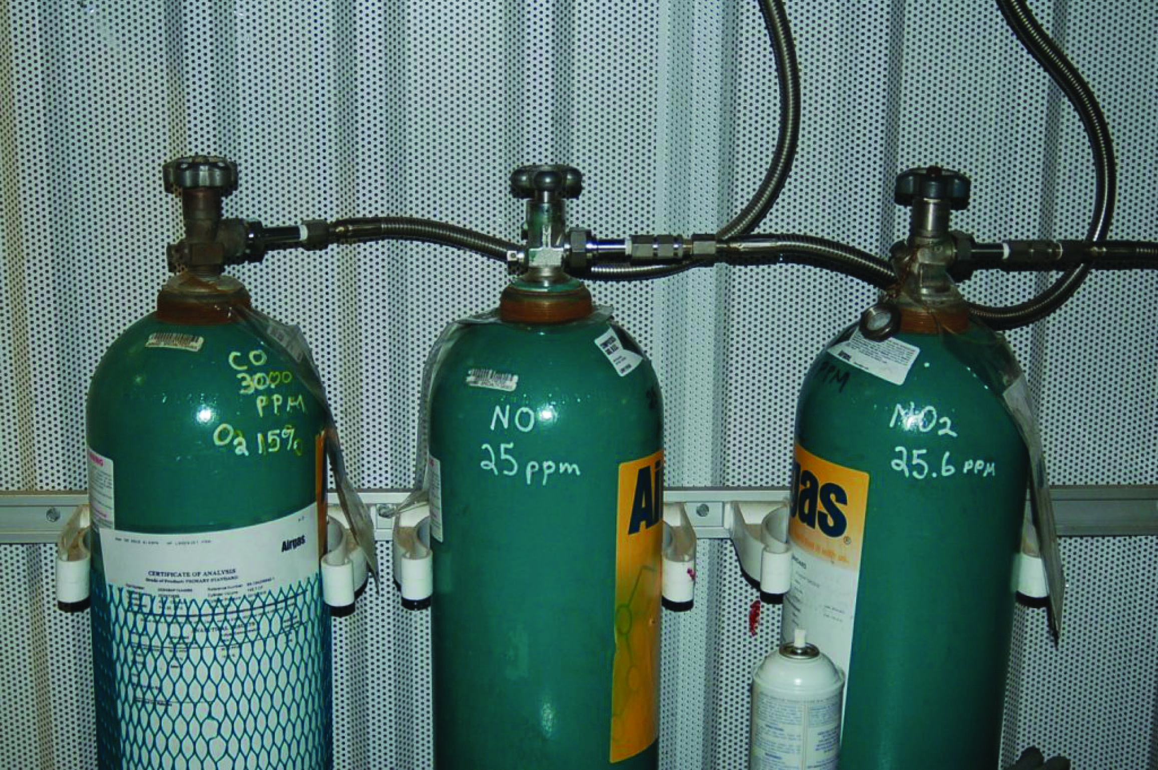 three span gas cylinders used in a CEMS self-calibration system