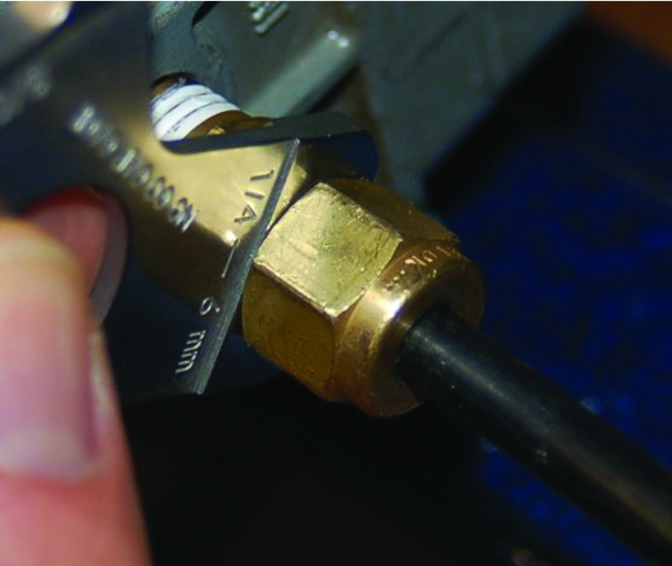 gauges testing a properly-tightened fitting
