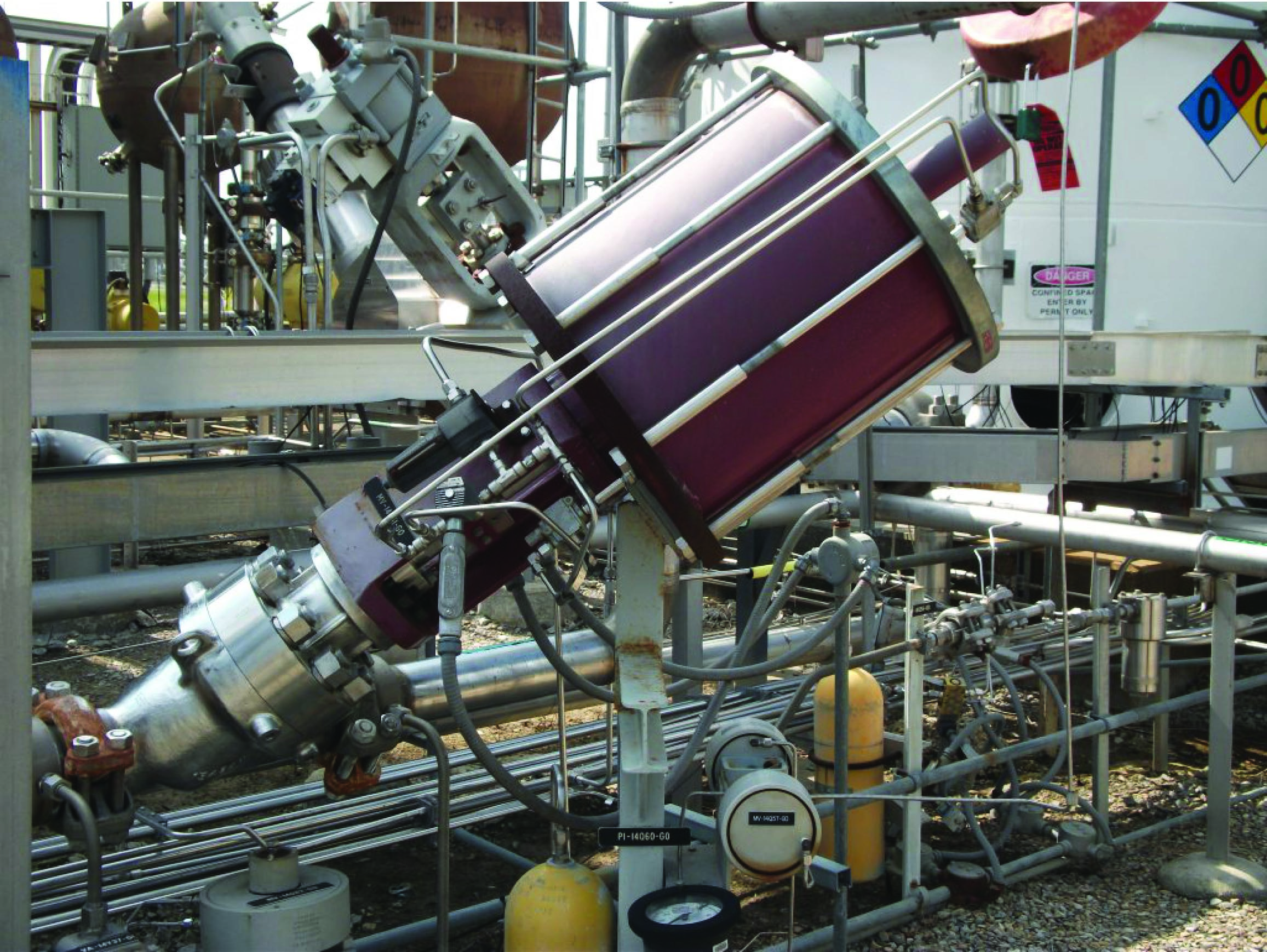 large pneumatic piston actuating a relatively tiny valve body